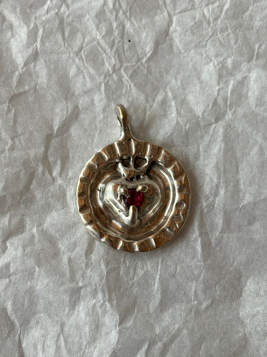 silver pendant with sacred heart, small ruby set in the centre